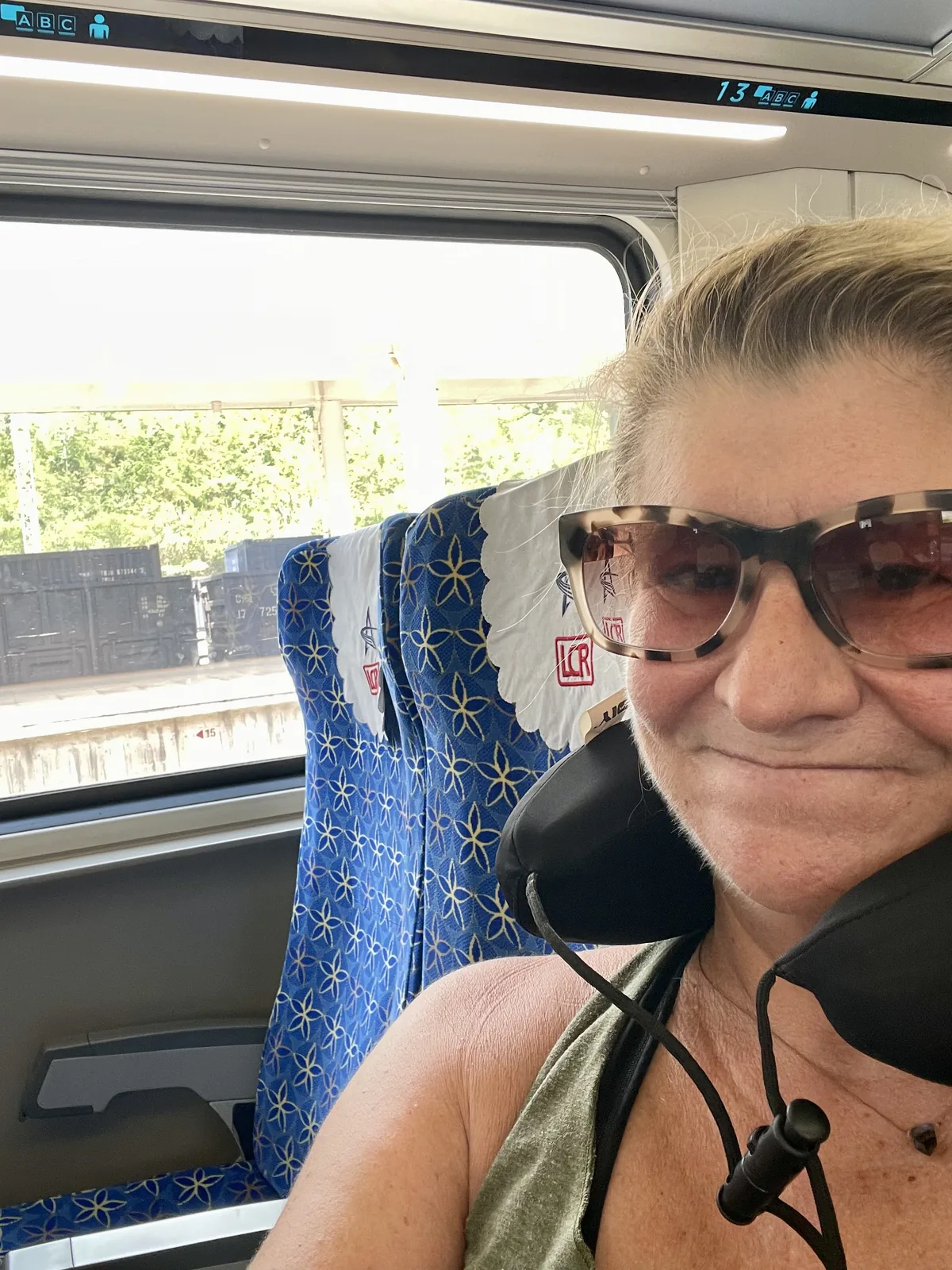 Jen seated on the China-Laos railway train heading south to Vang Vieng