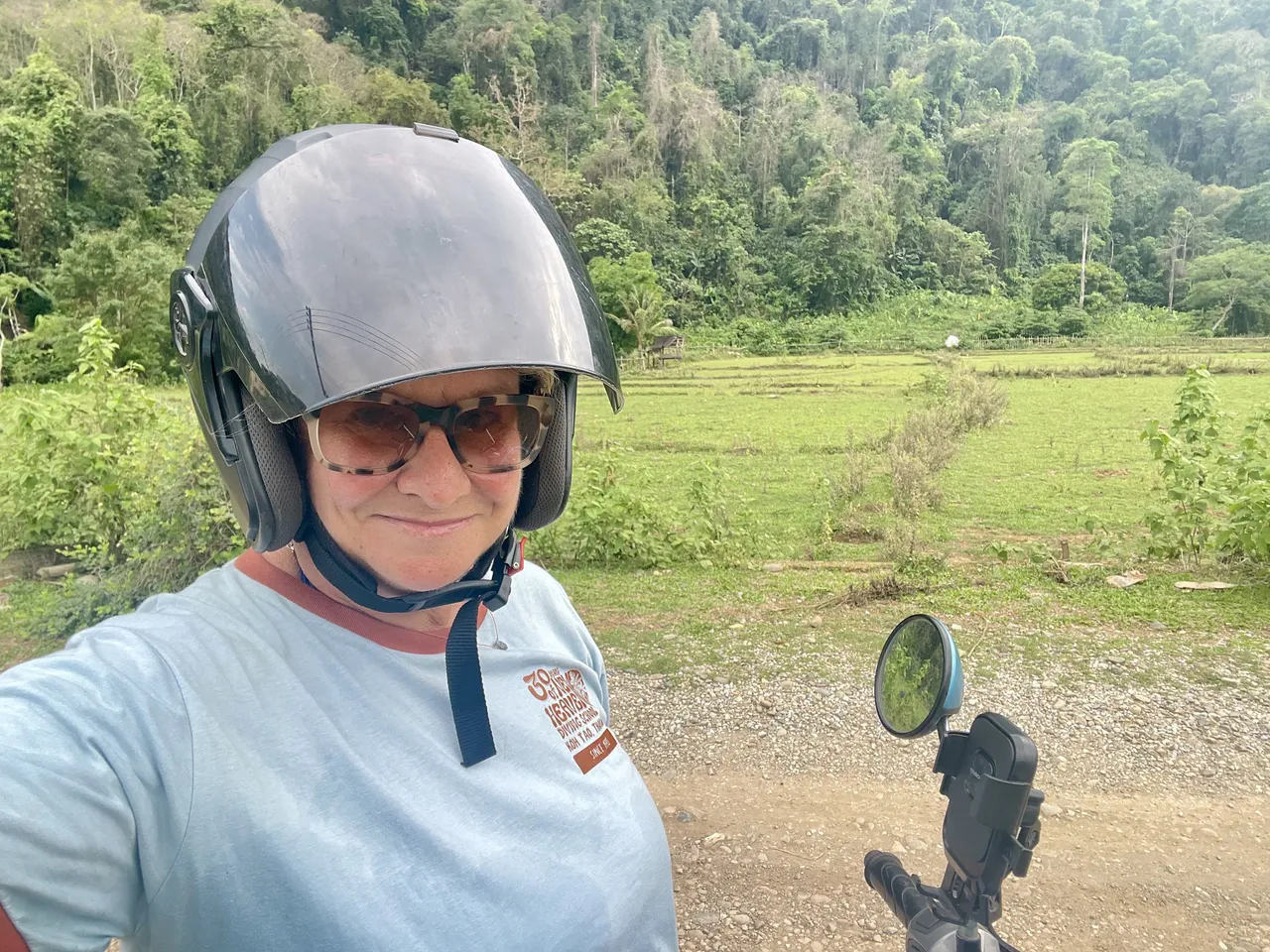 Jennifer on her rented Honda Scoopy during a motorbike ride through the Vang Vieng countryside