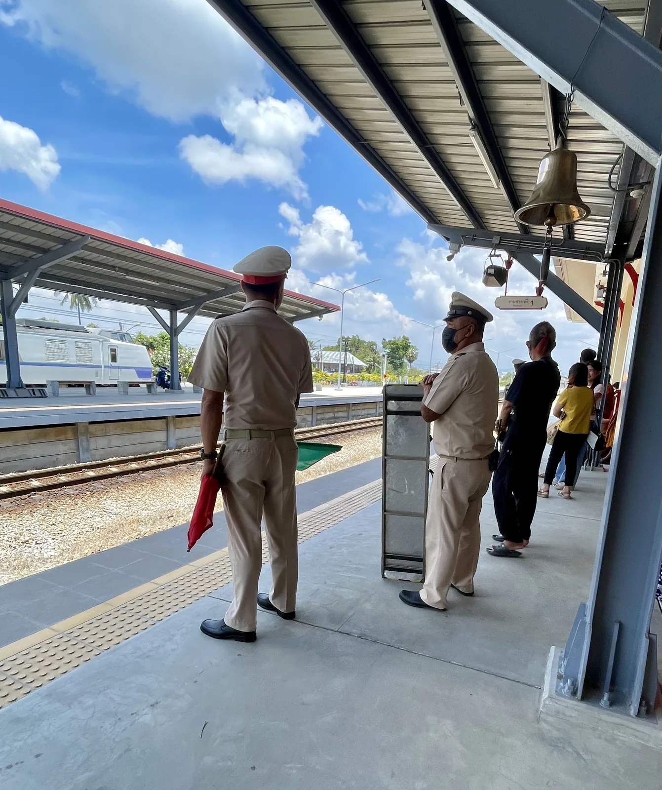 Train officers at a station in Thailand awaiting the next train south to Chumphon